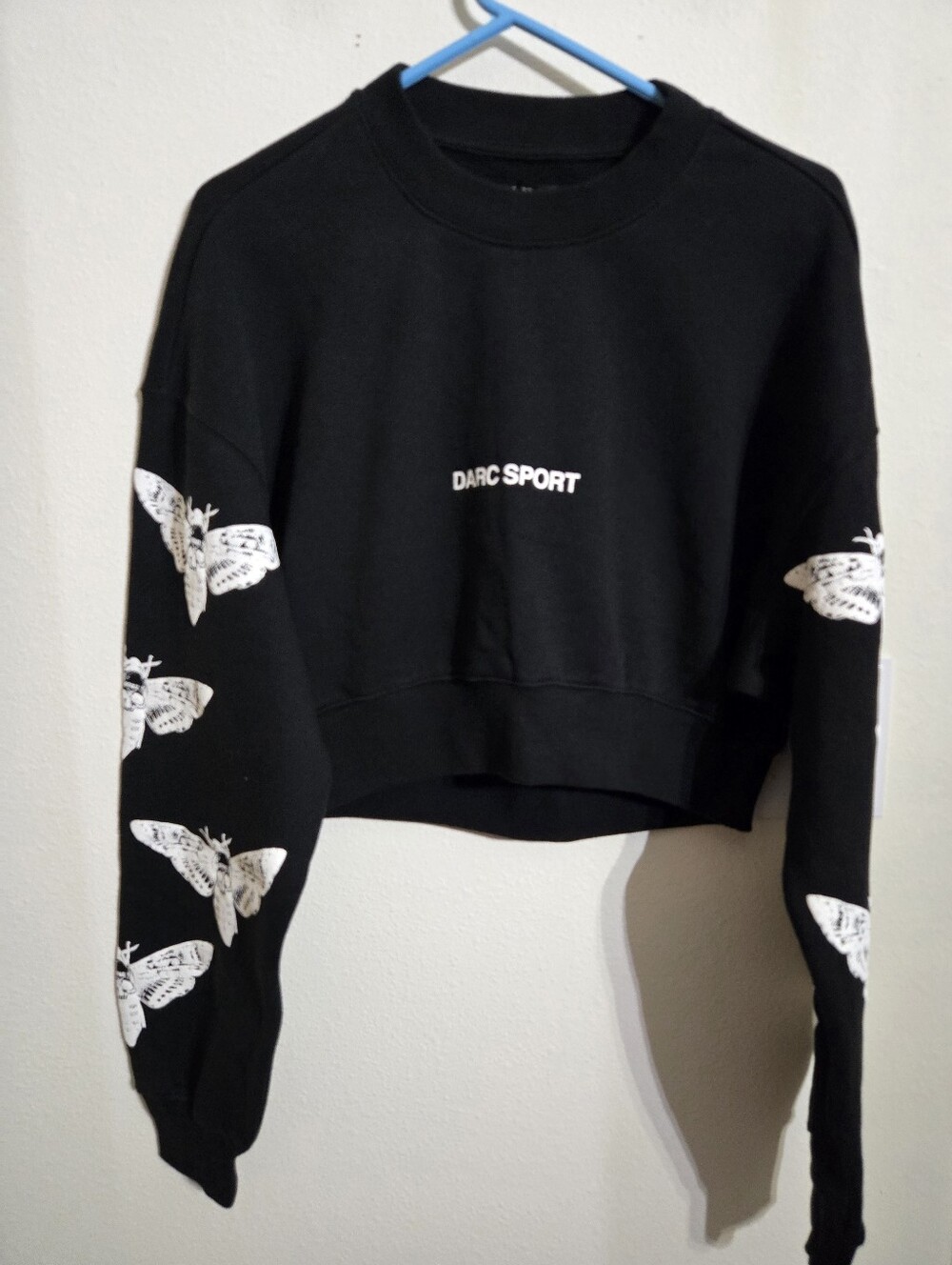 Darc Sport Black Cropped Crewneck Sweatshirt with White Butterfly Motif